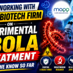 News-style thumbnail highlighting an experimental Ebola treatment collaboration between the United States and a biotech firm. Features an Ebola virus illustration, laboratory scientist, treatment vial, microscope, and biotechnology research visuals.