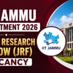 Promotional thumbnail for IIT Jammu Recruitment 2026 featuring a Junior Research Fellow (JRF) vacancy announcement, IIT Jammu logo, and a modern campus building on a maroon background.