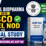YouTube thumbnail showing Kemwell Biopharma receiving CDSCO panel approval for a clinical study of ASP100, a Dupilumab biosimilar, with bold text, CDSCO emblem, biosimilar vial, and clinical research visuals.