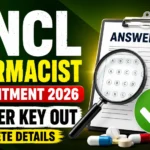 NCL Pharmacist Recruitment 2026 Answer Key Out thumbnail featuring the Coal India logo, answer key sheet, magnifying glass, medicines, and pharmacist recruitment announcement.
